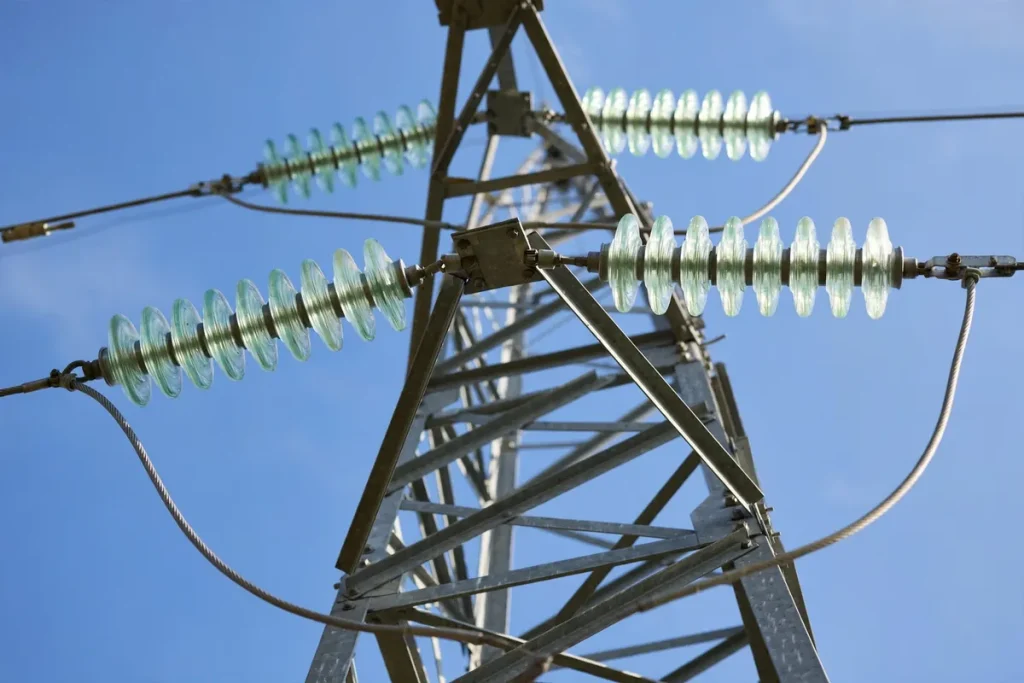 High-voltage transmission tower with power lines — FESCO electricity distribution network